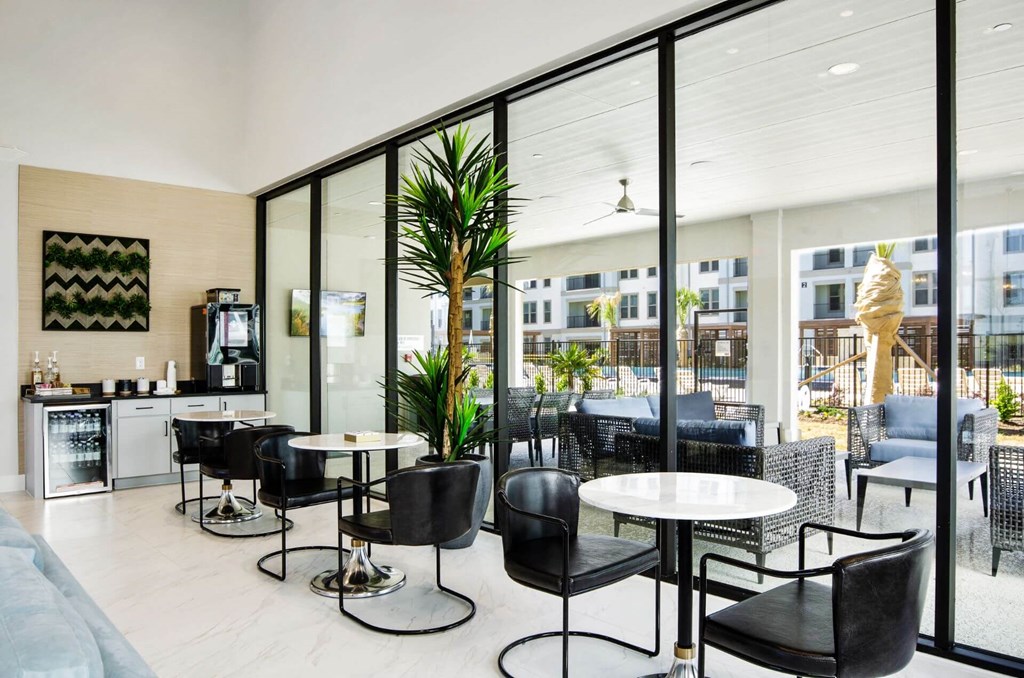 clubhouse dining with table and black chairs at Reveal at Bayside, Rowlett, 75088