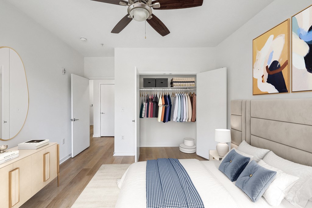 a bedroom with a bed and a closet