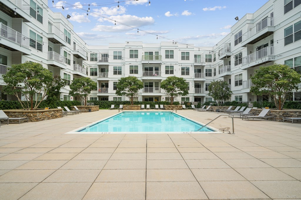 a swimming pool in the middle of an apartment building
