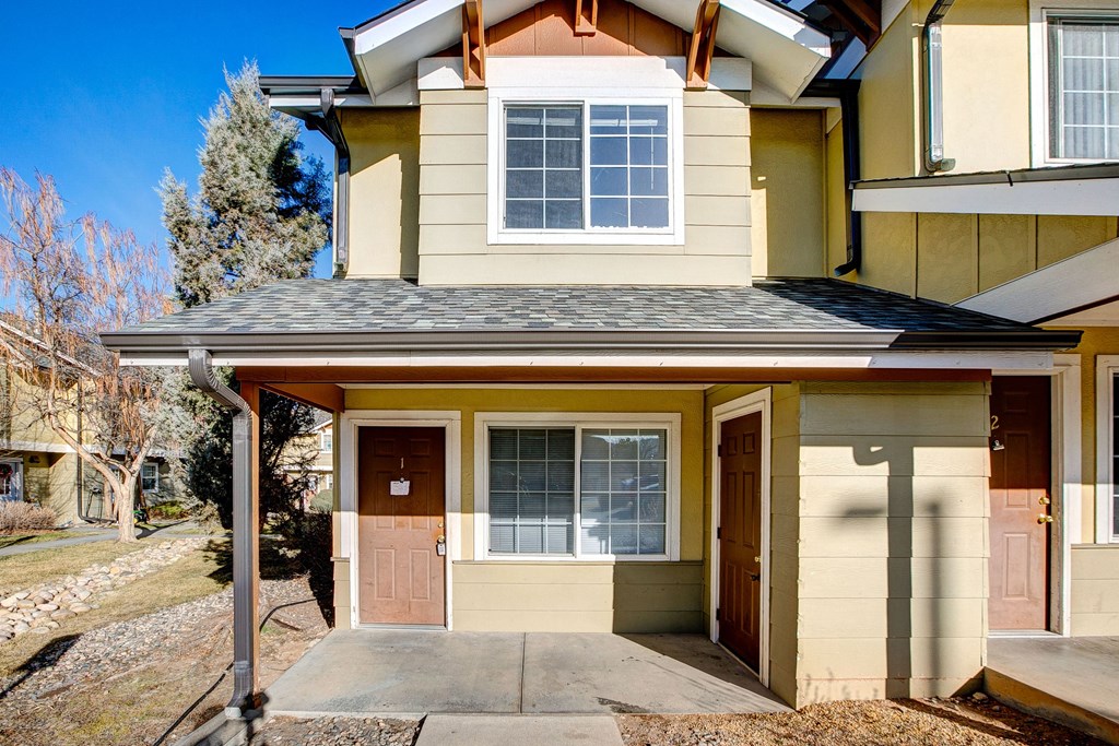 A house with a brown door and a window.