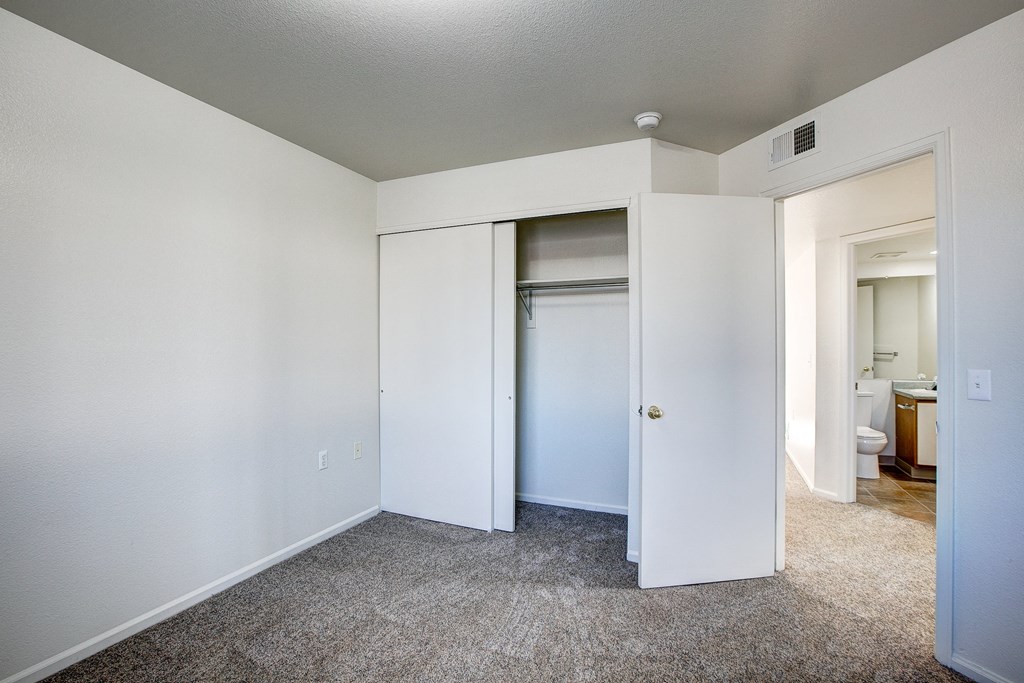 A white door is open to a bathroom.