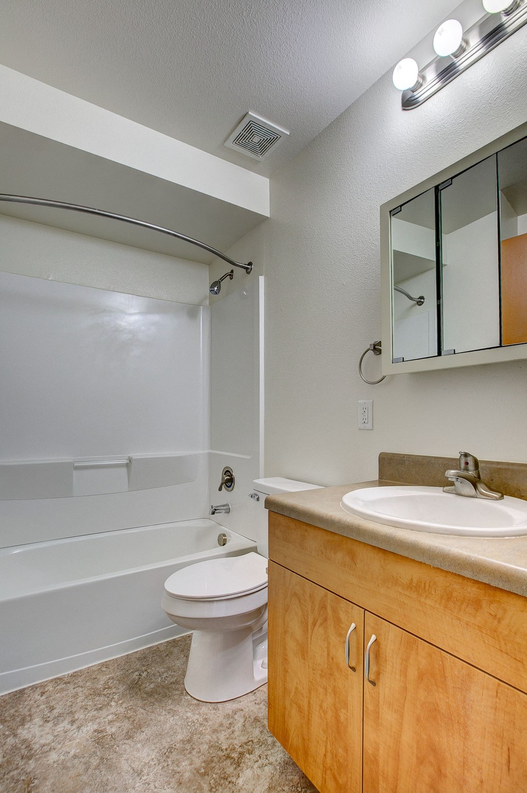 an empty bathroom with a toilet and a sink