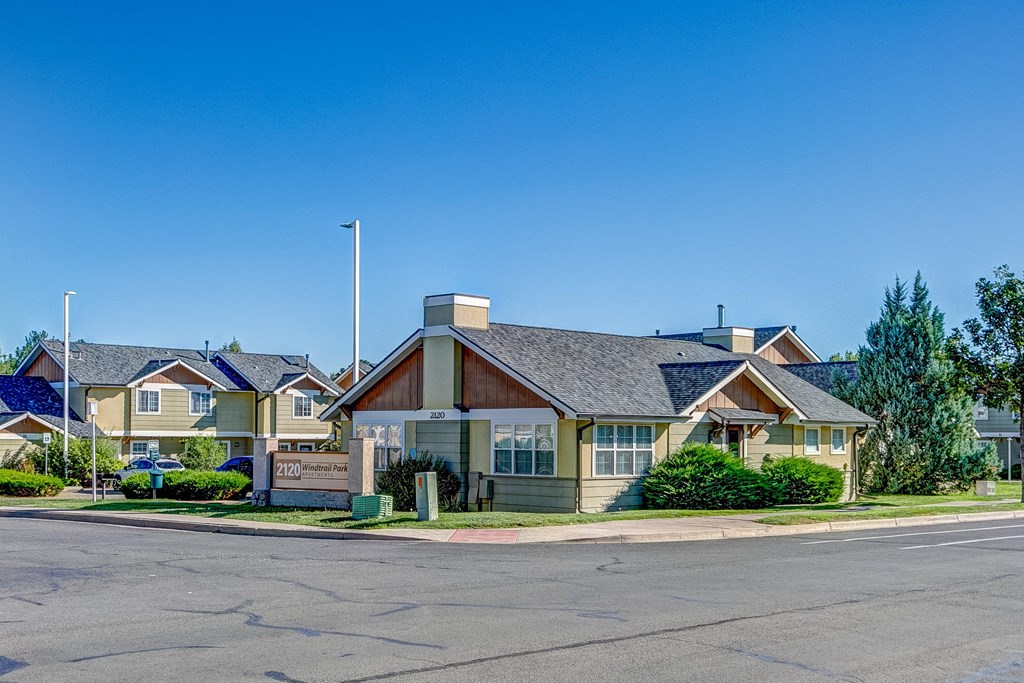 a row of houses on the corner of a street