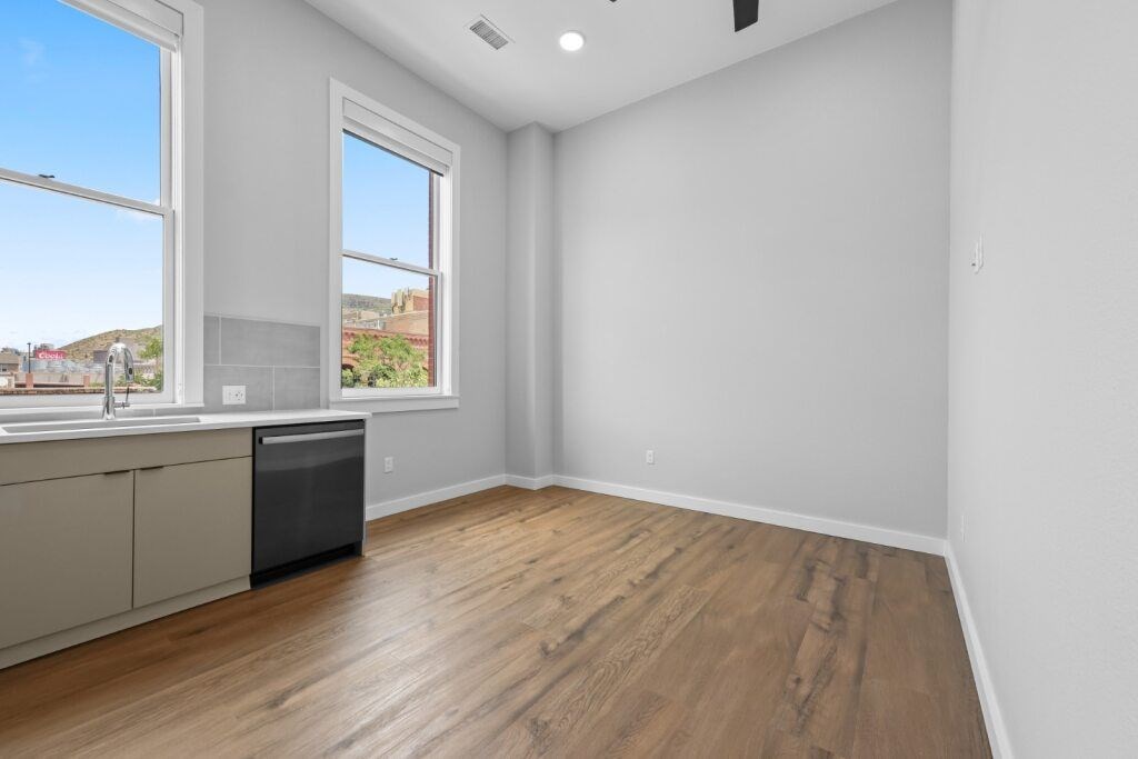 A room with a window overlooking a construction site at The Avenue Lofts Golden Apartments, Colorado, 80401