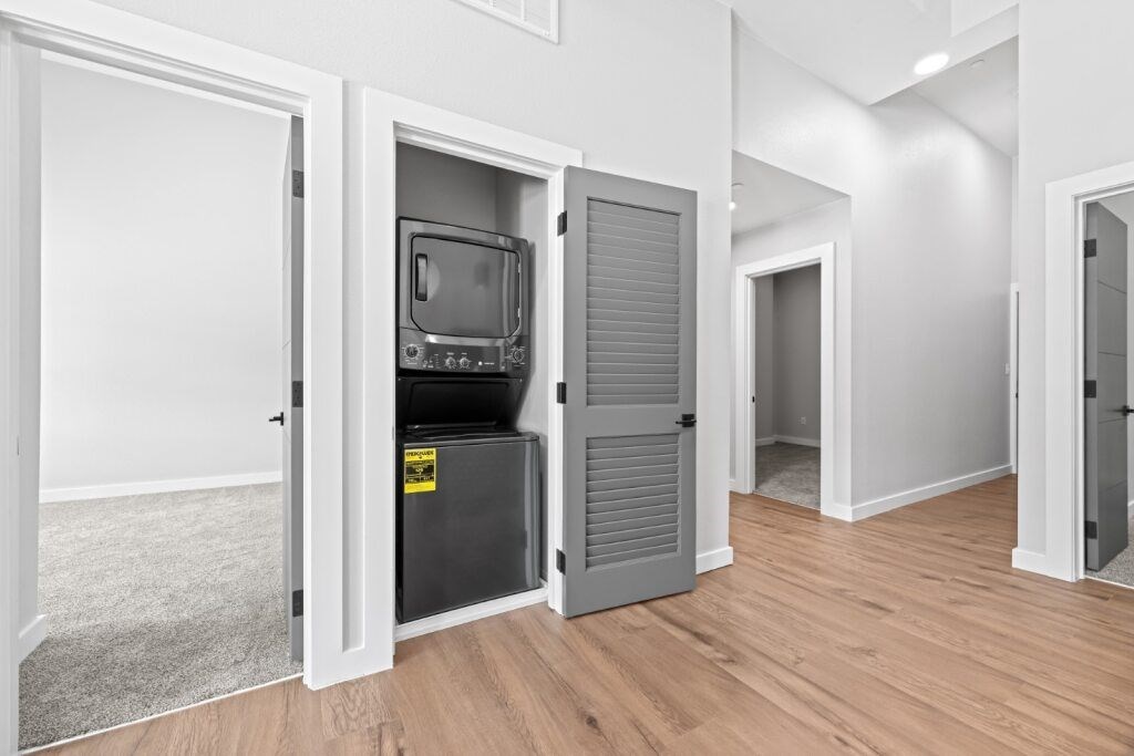 A room with a television in a cabinet at The Avenue Lofts Golden Apartments, Colorado, 80401