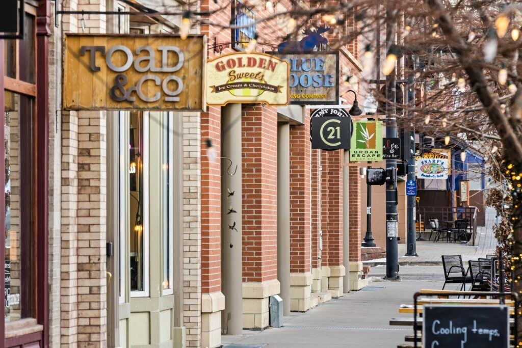 A street with a sign at The Avenue Lofts Golden Apartments, Golden