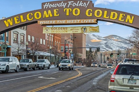 Downtown archway sign welcoming visitors to town at The Avenue Lofts Golden Apartments, Golden, CO