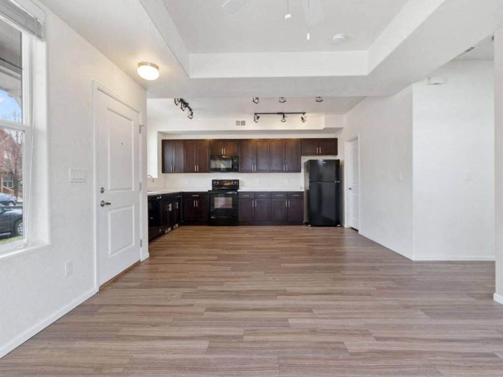 Living Area With Kitchen View at Belle Creek Commons, Henderson