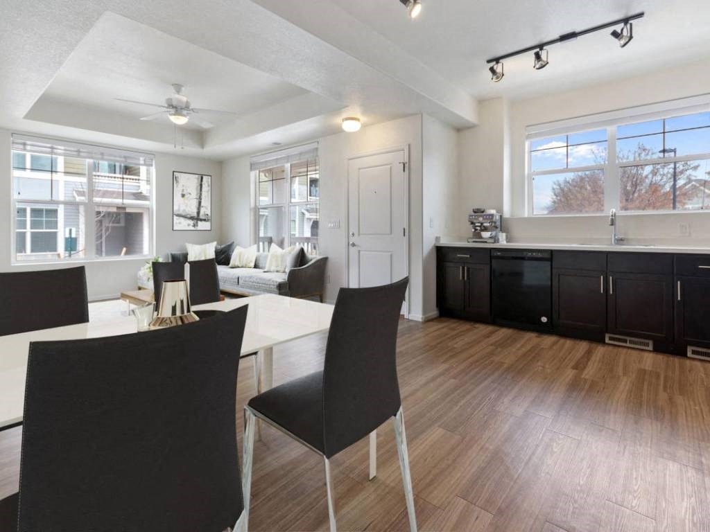 Dining Area With Living Room View at Belle Creek Commons, Henderson, 80640