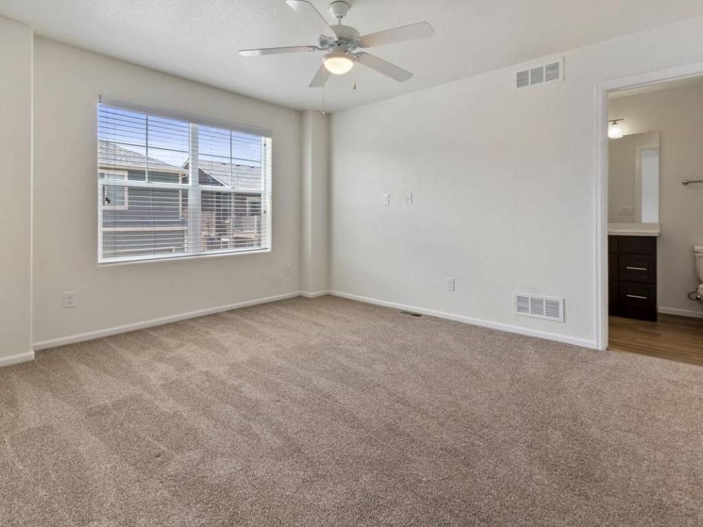 Ceiling Fan In Bedroom at Belle Creek Commons, Henderson, CO, 80640