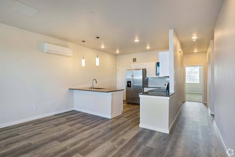 a kitchen with a counter top and a refrigerator