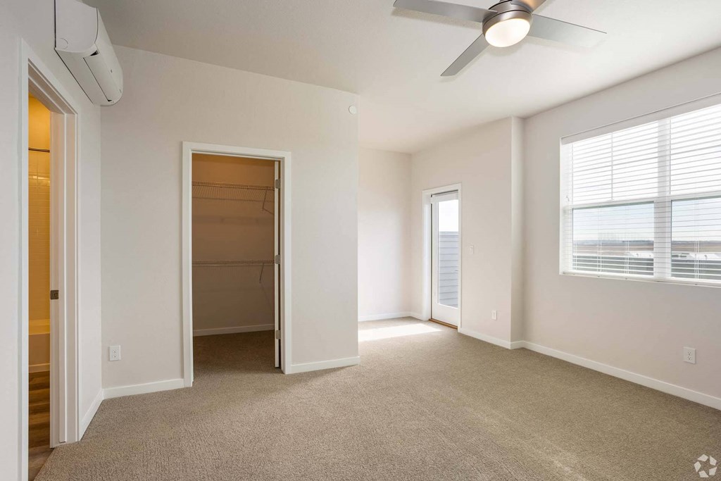 bedroom with carpet and large closet at Palisade Park Townhomes, Colorado, 80023