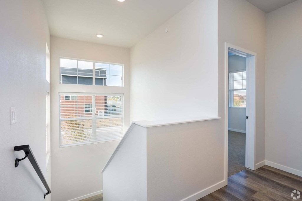 staircase looking down with window at Palisade Park Townhomes, Broomfield, 80023