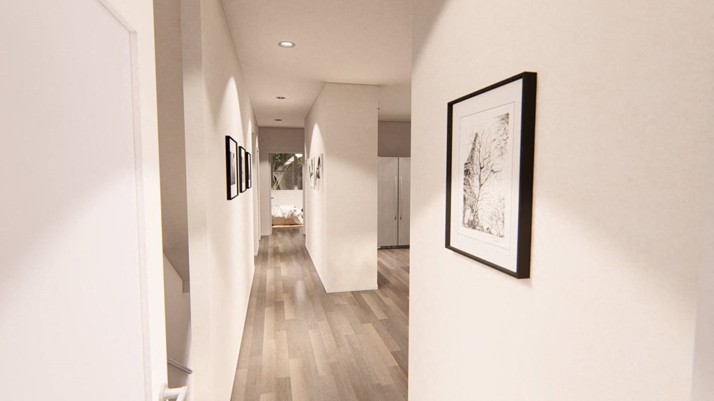 a long hallway with white walls and wooden floors at Brownstones at Palisade Park, Colorado