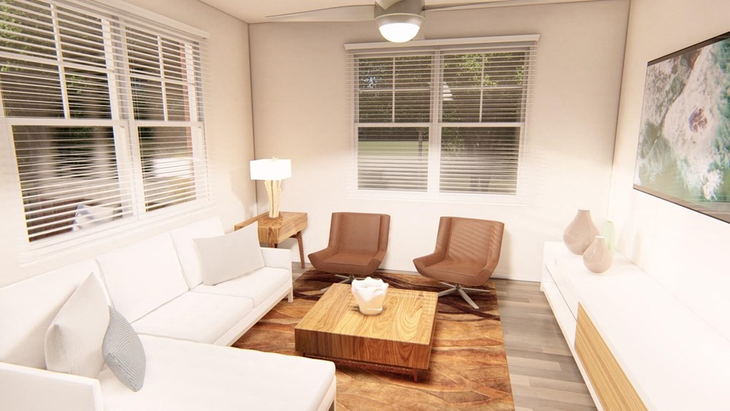 a living room with white couches and chairs and a wooden coffee table at Brownstones at Palisade Park, Colorado