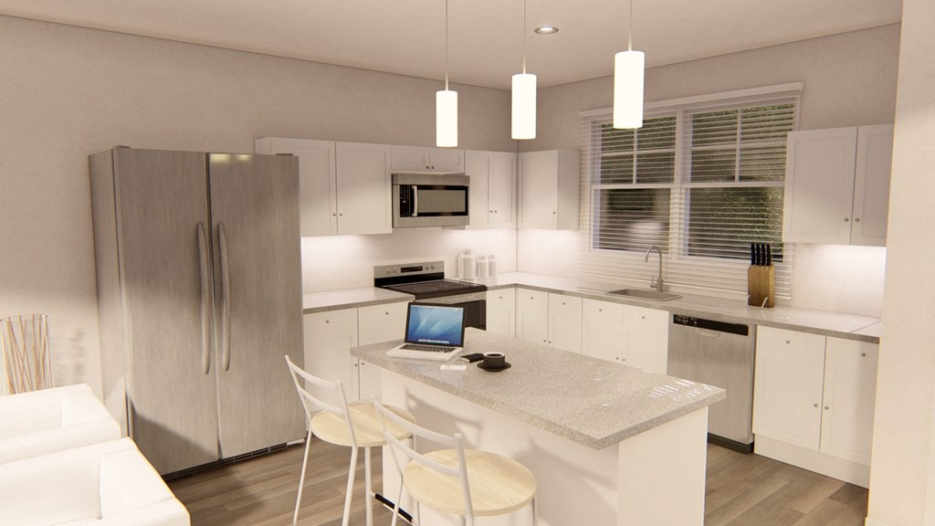 a kitchen with a refrigerator freezer next to a stove top oven at Brownstones at Palisade Park, Broomfield, 80023