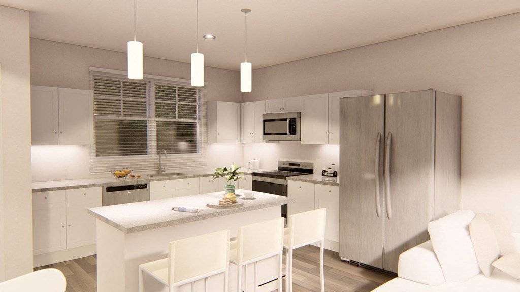 a kitchen with white cabinets and a white island with white chairs at Brownstones at Palisade Park, Broomfield Colorado