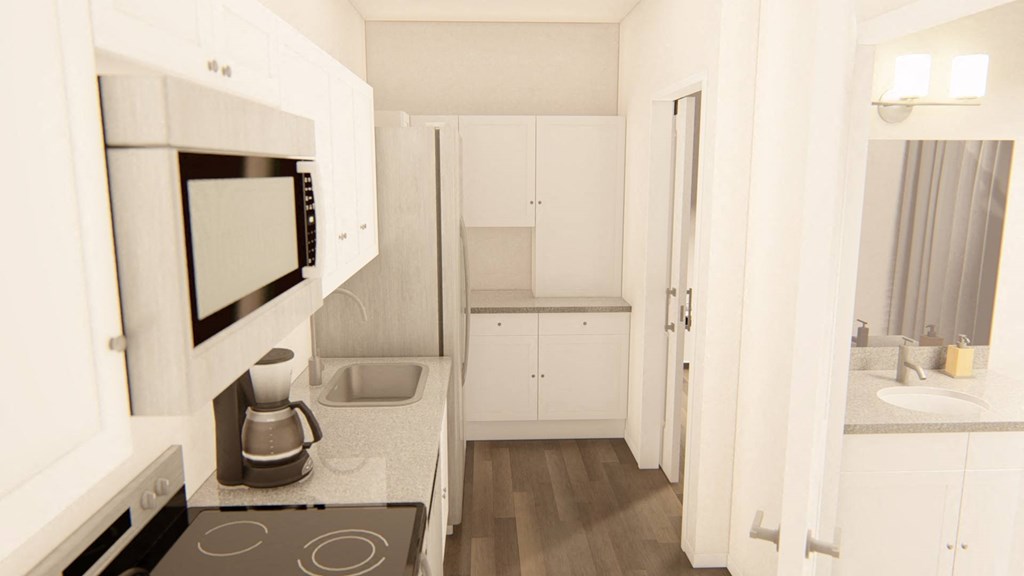 a kitchen with a stove top oven next to a microwave at Brownstones at Palisade Park Townhomes, Broomfield, 80023