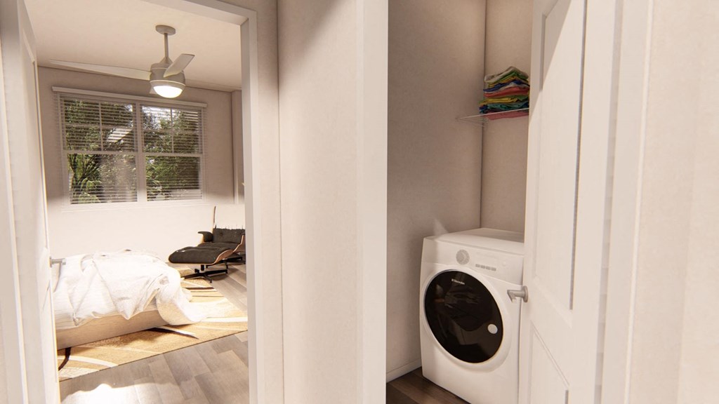 a small laundry room with a washer and dryer at Brownstones at Palisade Park, Colorado