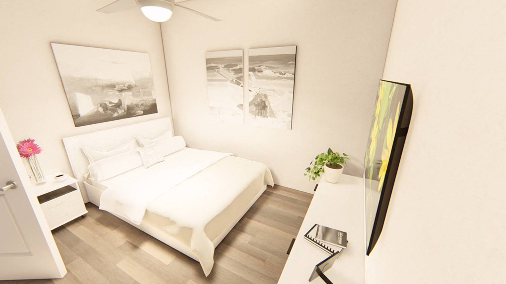 a bedroom with a bed and a desk at Brownstones at Palisade Park Townhomes, Broomfield