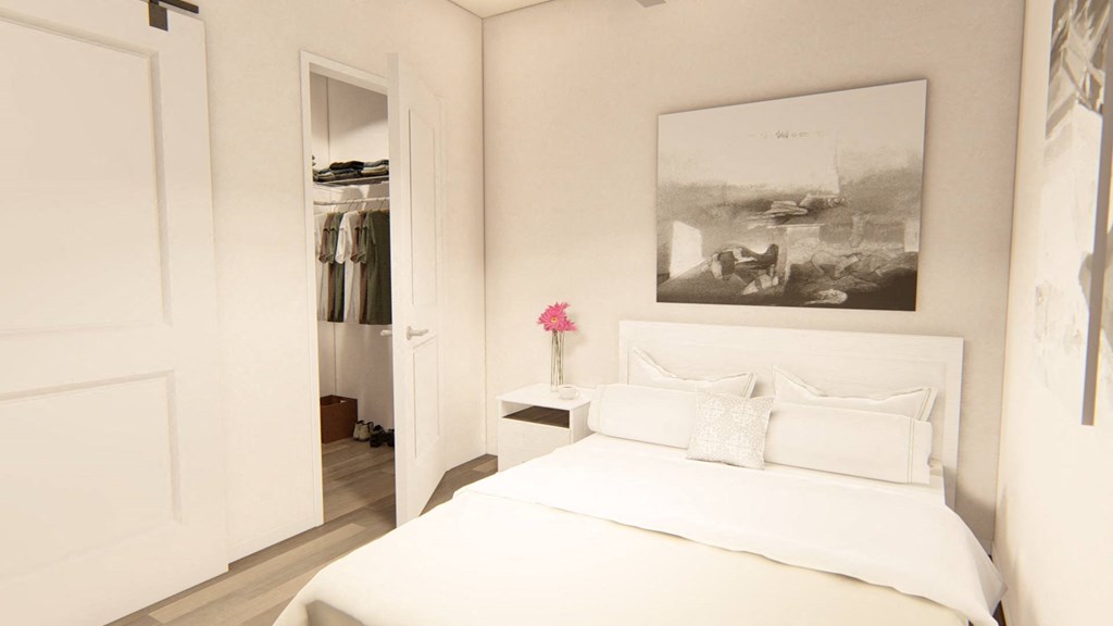 a bedroom with a large bed and a closet at Brownstones at Palisade Park Townhomes, Broomfield, 80023