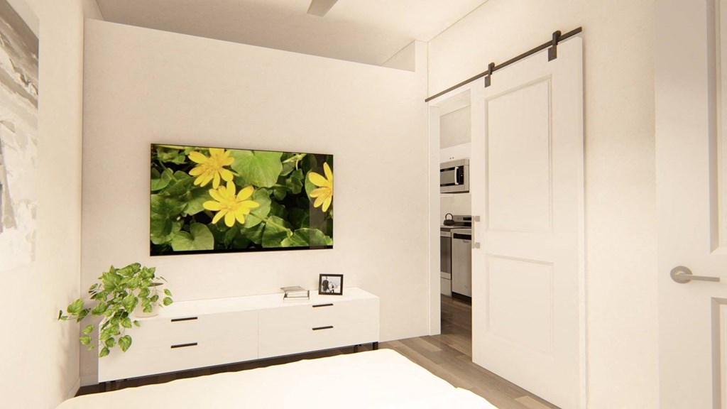 a white bedroom with a painting of yellow flowers on the wall at Brownstones at Palisade Park Townhomes, Colorado, 80023