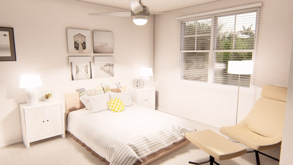 a bedroom with a bed and a chair in front of a window at Brownstones at Palisade Park Townhomes, Broomfield, 80023