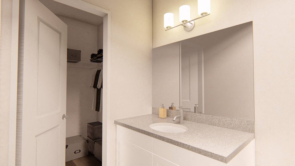a bathroom with a sink and a mirror at Brownstones at Palisade Park Townhomes, Colorado, 80023