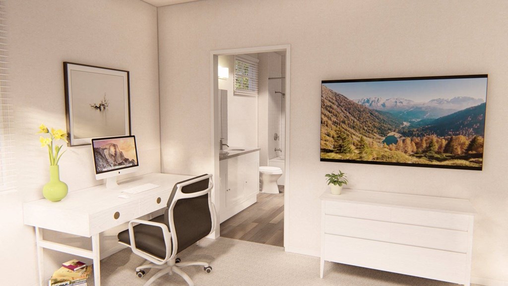 a bedroom with a desk and a chair in front of a tv at Brownstones at Palisade Park Townhomes, Broomfield, 80023
