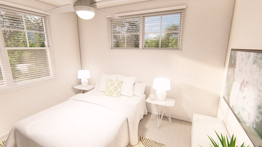 a bedroom with a bed and three windows at Brownstones at Palisade Park Townhomes, Broomfield, 80023