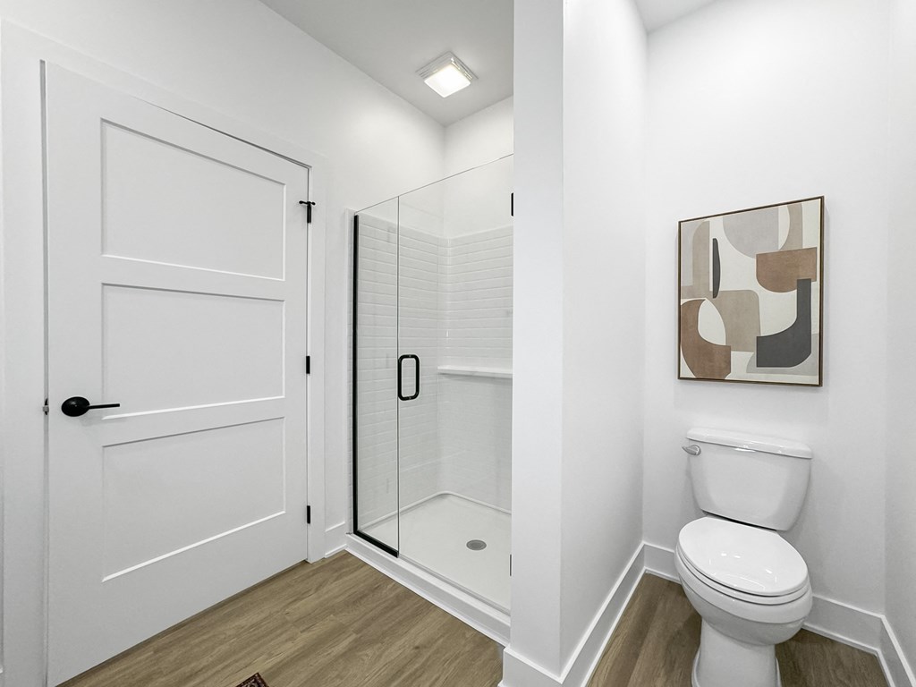 a small bathroom with a toilet and a shower