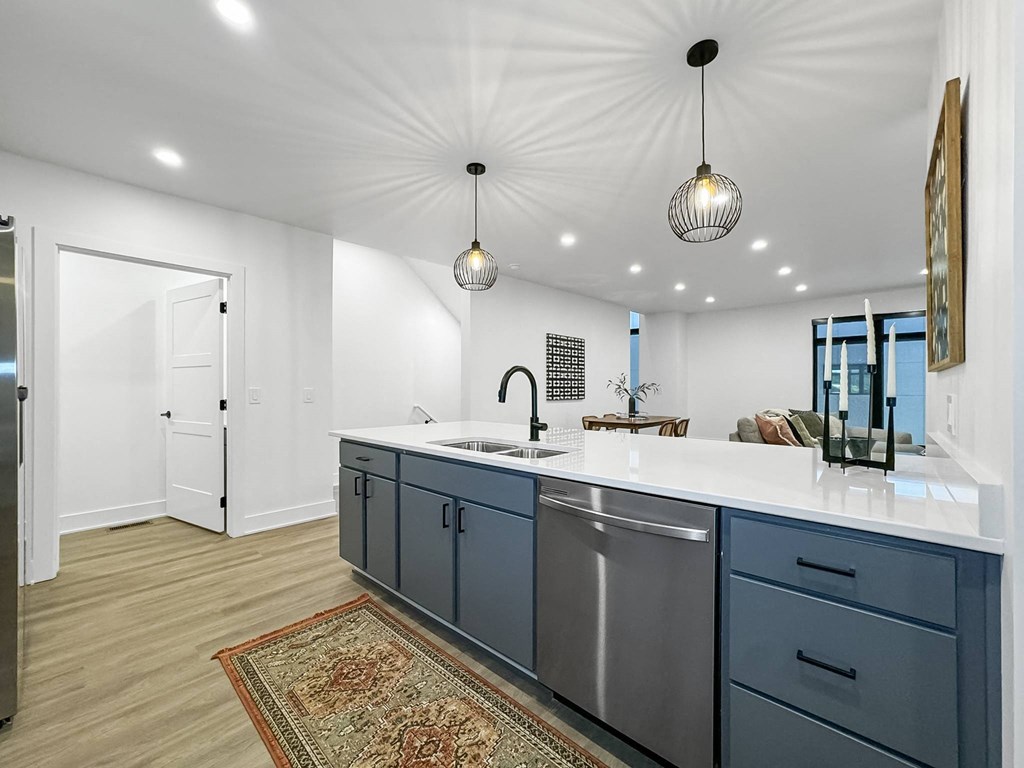 a kitchen with a large counter top and a sink