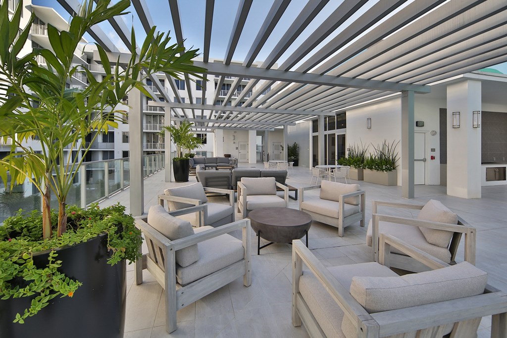 Rooftop/Sundeck Area with multiple seating options for gatherings or relaxation, open to the breeze and sunlight.