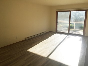 Living Room Image of living space with glass doors leading on to porch - Photo Gallery 4