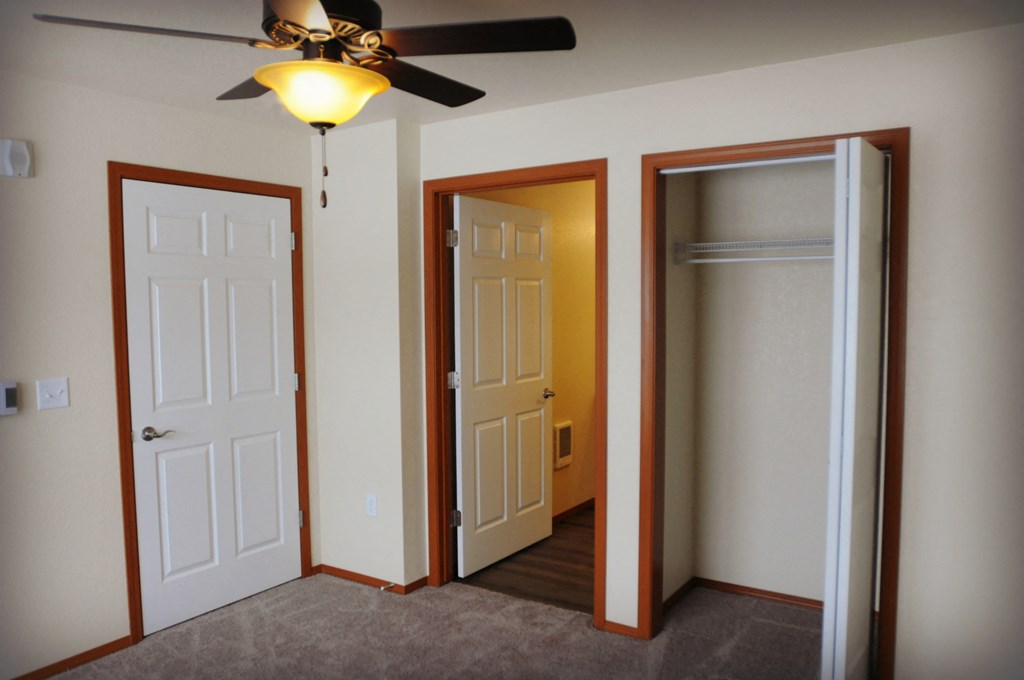 Closet Image of space containing hanger racks
