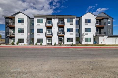 A Twin Creek Apartments a modern apartment buildings with balconies and multiple windows.