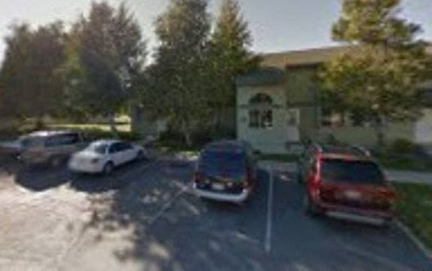 a blurry image of cars parked in a parking lot