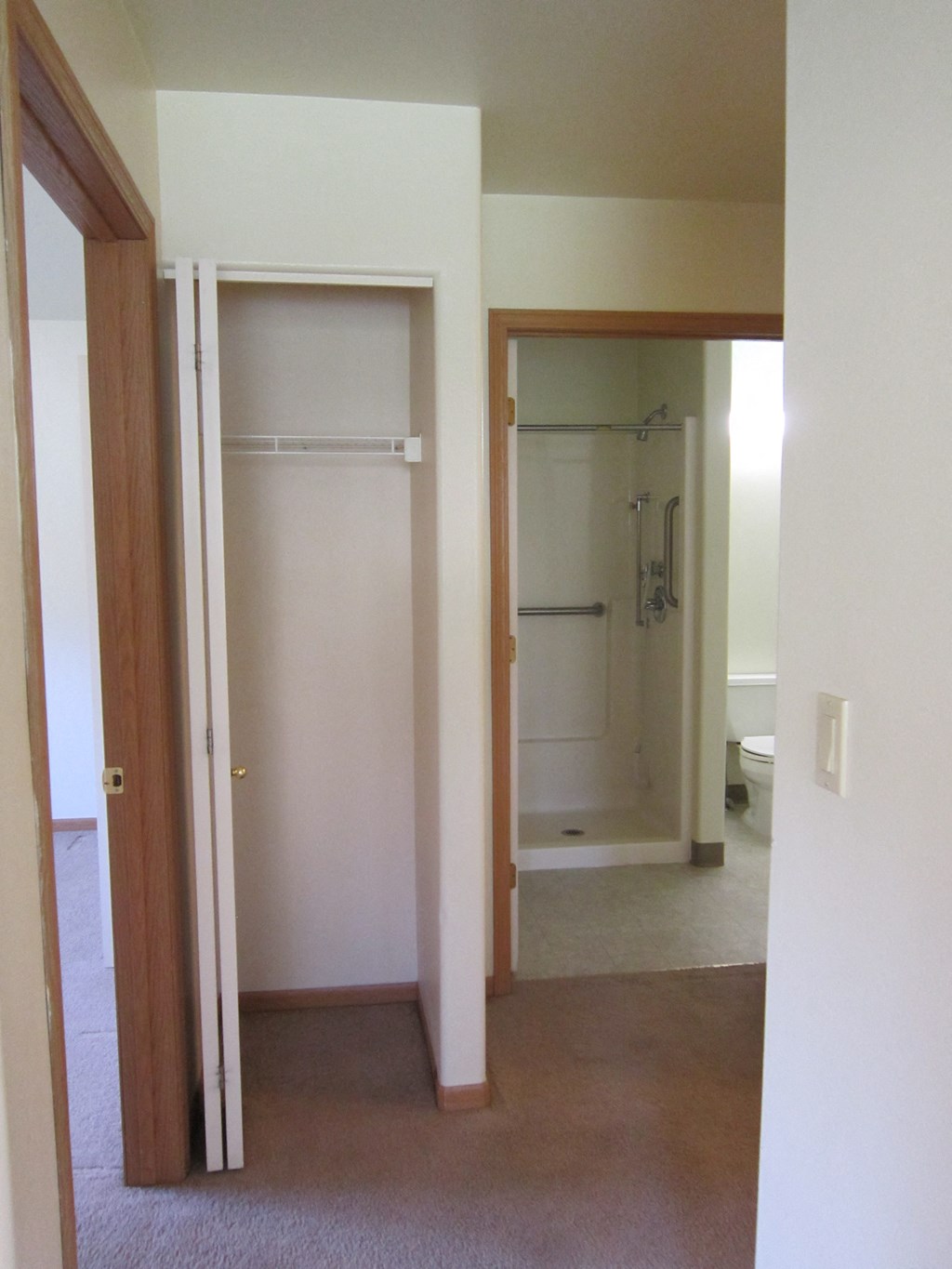 Image of small closet with hanger rack