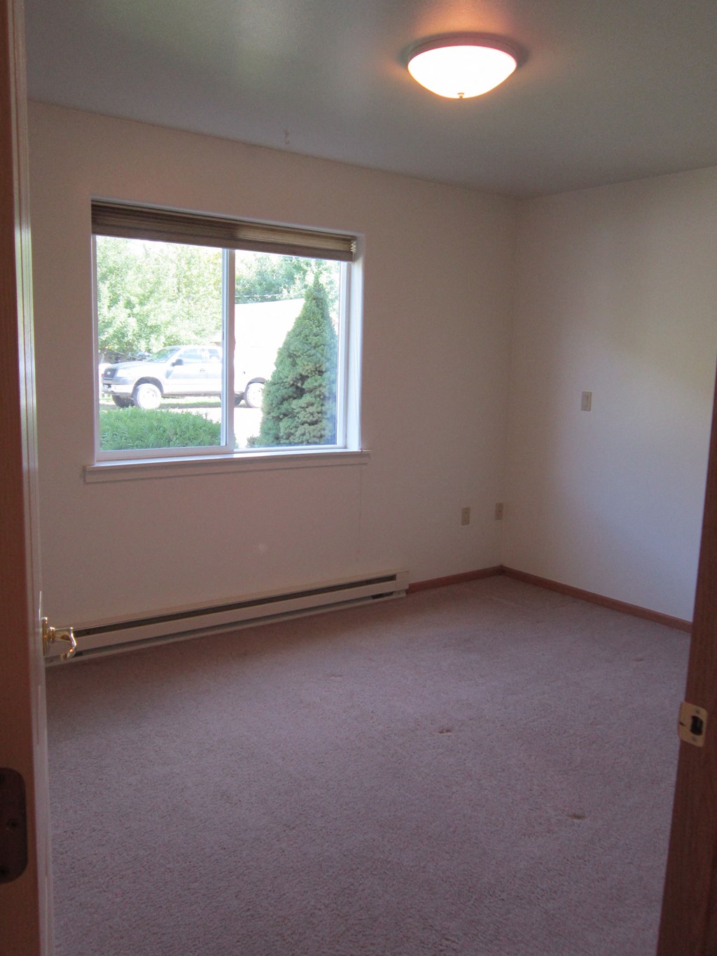 Image of window and heater in bedroom