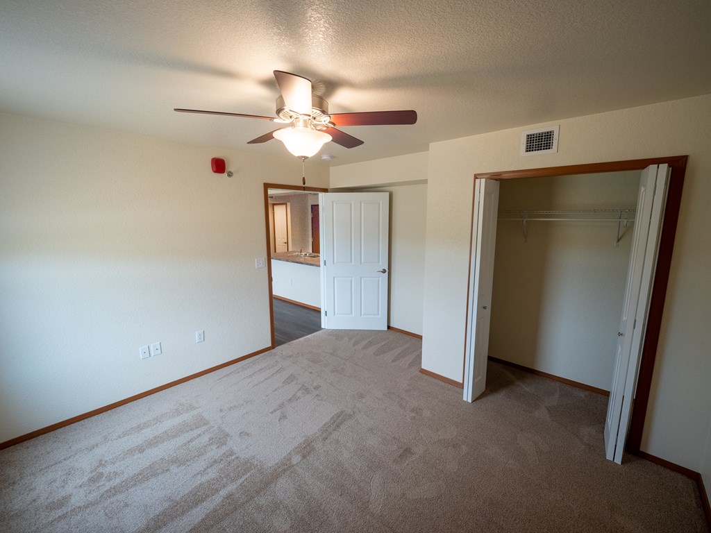 Image of bedroom and closet with hanger rack