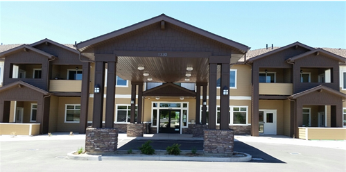 a picture of the front of Parkway Vista Senior with a blue sky in the background