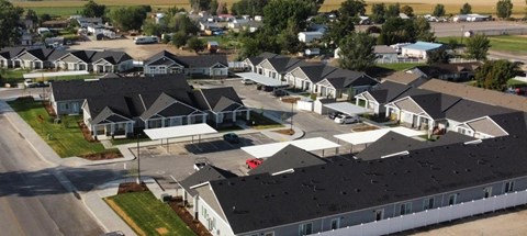 an aerial view of a neighborhood of houses with roofs