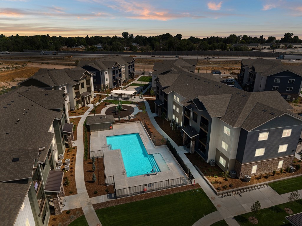 An ariel view of the apartment community and the swimming pool.