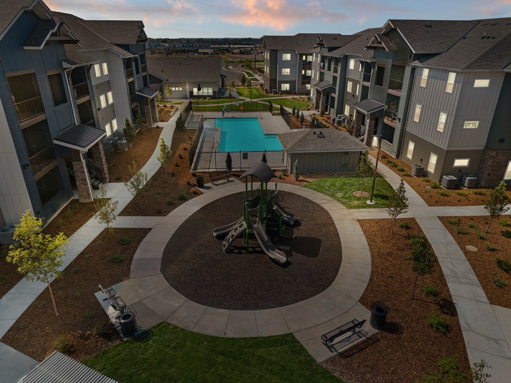 A view of a courtyard with a pool and a gazebo.