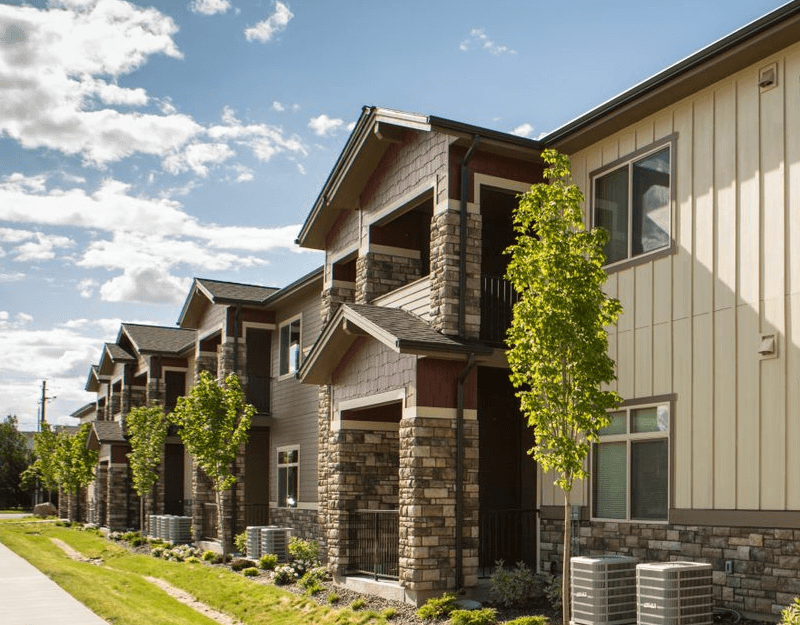 side of Vineyard at Eagle Promenade with stone and wood exterior