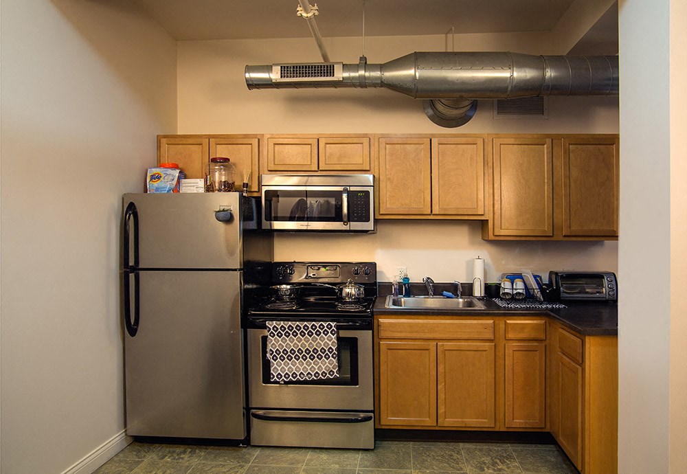 Spacious kitchen with appliances at the Lofts at 5 Lyon, in downtown Grand Rapids, MI