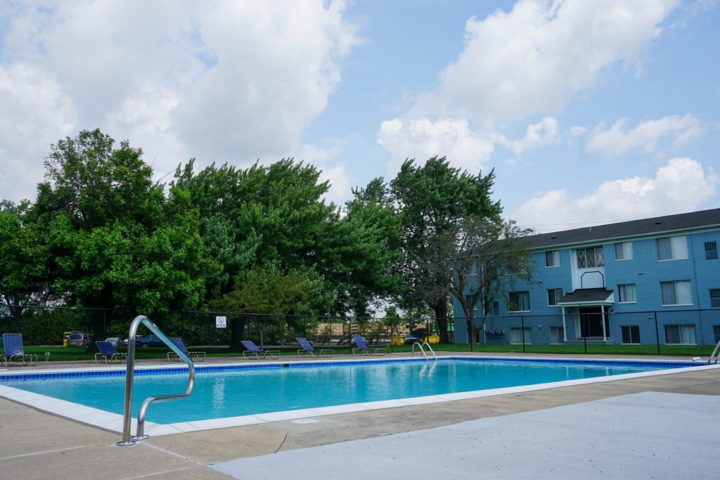 Resort Style Swimming Pool with pool chairs and easy entry, at Gale Gardens Apartments
