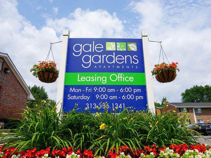 Gale Gardens Leasing Office sign with flower landscaping