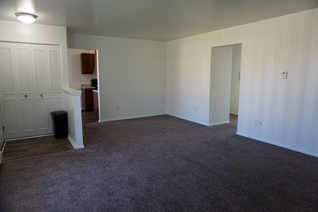 Apartment entrance and living room at Huntington Club Apartments in Warren, Michigan