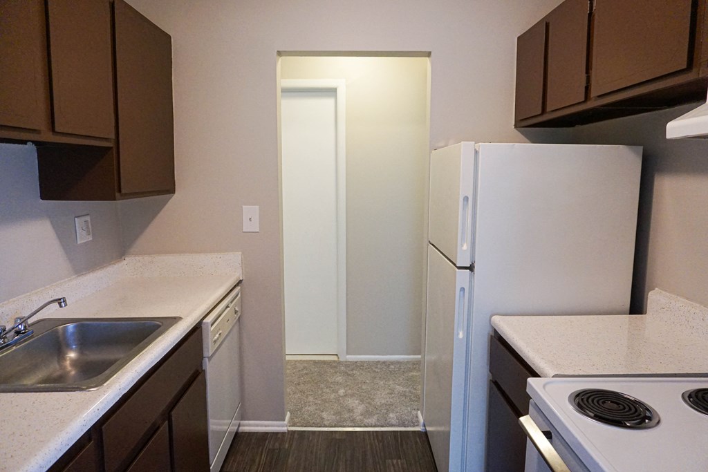 Kitchen with appliances at Riverstone Apartments in Southfield, Michigan